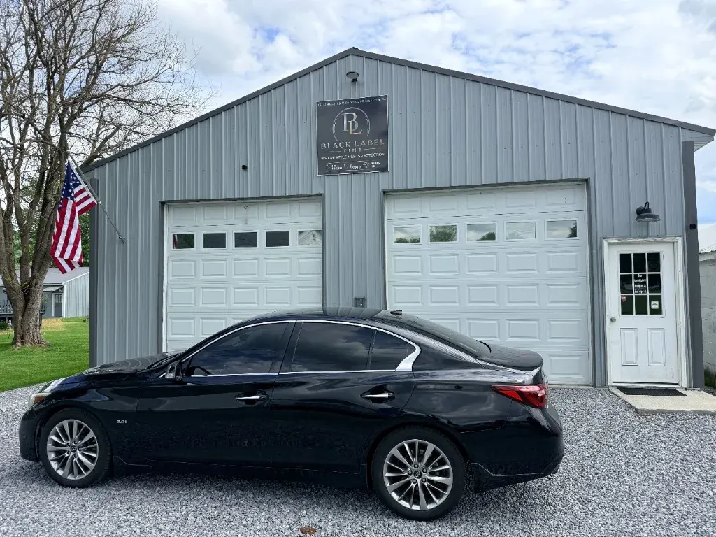 Black Infiniti outside Black Label Tint's shop in Pennsylvania