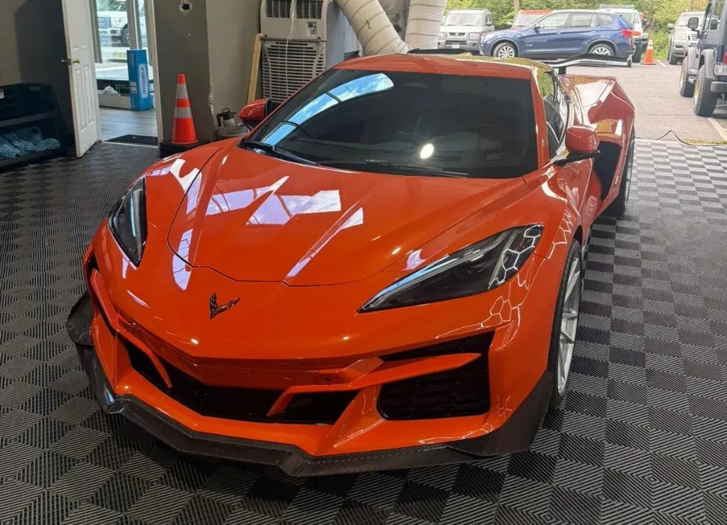 Orange Corvette C8 inside Deluxe Paint Protection's shop in Northern Virginia