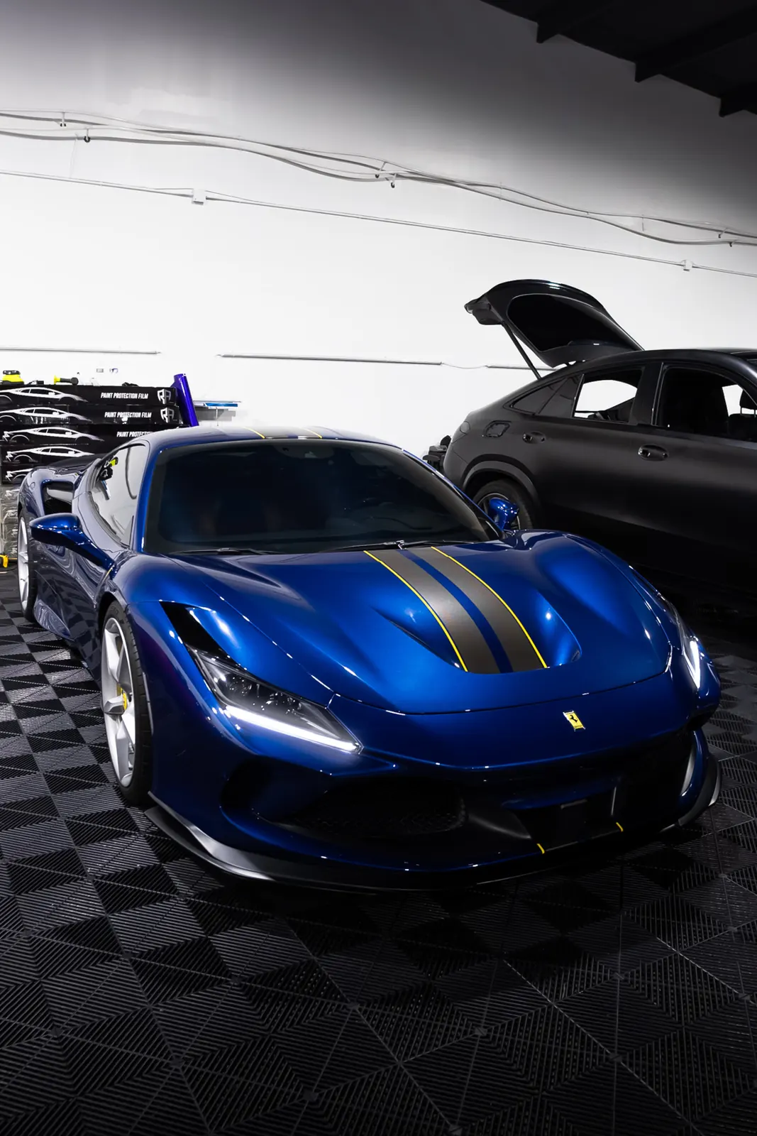 Blue Ferrari with paint protection film at JLE Customs